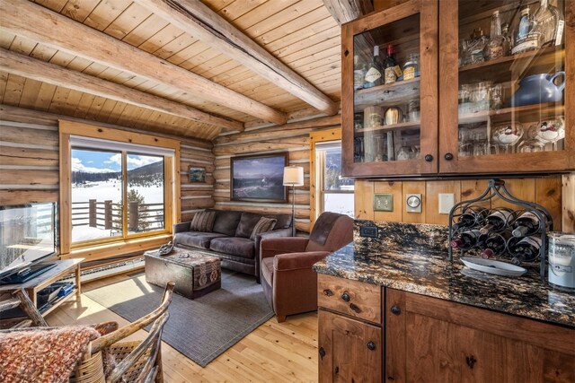 82 Potentilla Ln, Keystone, CO 80435 - living room with light wood-style floors, beam ceiling, wood ceiling, a baseboard radiator, and log walls