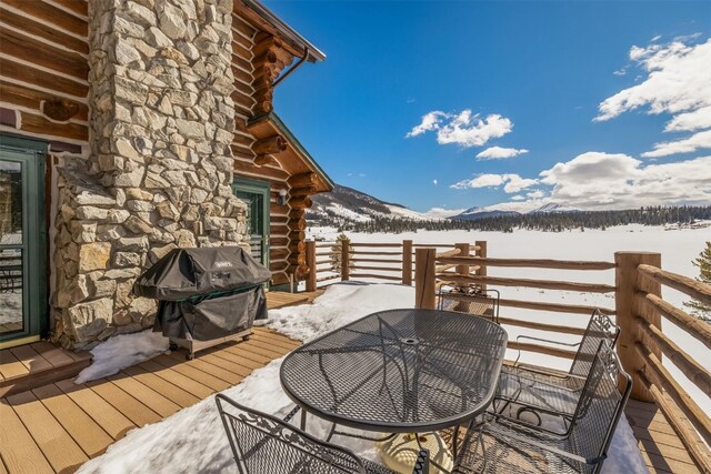82 Potentilla Ln, Keystone, CO 80435 - snow covered deck featuring outdoor dining area, a grill, and a mountain view