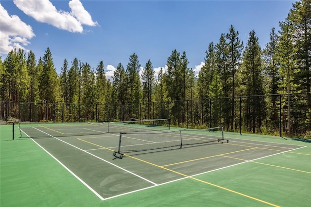 82 Potentilla Ln, Keystone, CO 80435 - view of tennis court featuring fence, community basketball court, and a wooded view