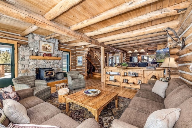 82 Potentilla Ln, Keystone, CO 80435 - living room featuring hardwood / wood-style floors, stairs, rustic walls, wood ceiling, and a wealth of natural light