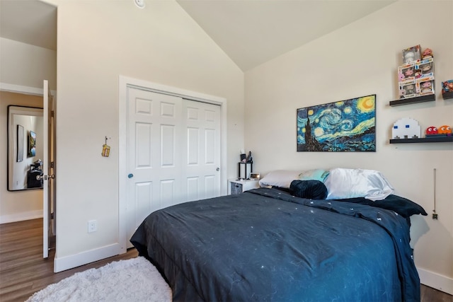 32 Wayback Dr Unit 32, Keystone, CO 80435 - bedroom with wood finished floors, baseboards, a closet, and high vaulted ceiling