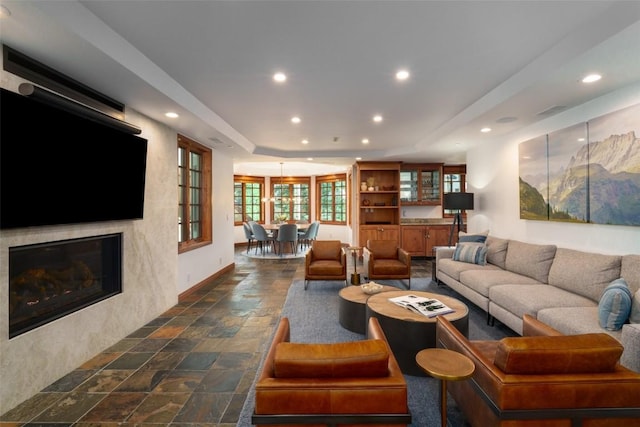 2600 Eagleridge Dr Unit 26, Steamboat Springs, CO 80487 - living room with recessed lighting, stone tile floors, a fireplace, and baseboards