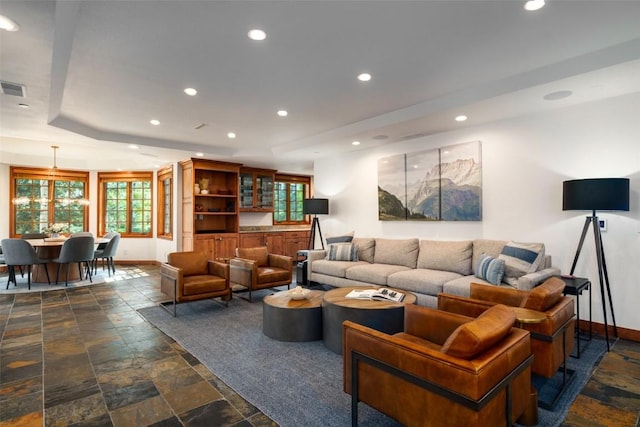 2600 Eagleridge Dr Unit 26, Steamboat Springs, CO 80487 - living room with stone tile flooring, baseboards, healthy amount of natural light, recessed lighting, and a raised ceiling