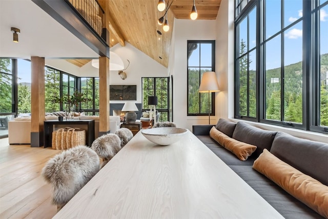 628 Independence Rd, Keystone, CO 80435 - dining space with a wooden ceiling with exposed beams, high vaulted ceiling, and wood finished floors