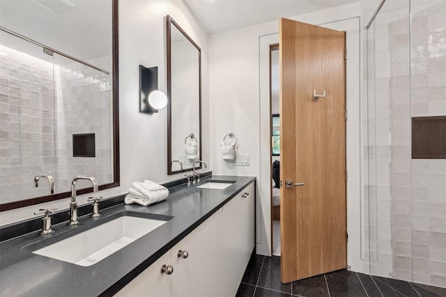 628 Independence Rd, Keystone, CO 80435 - ensuite bathroom featuring double vanity, a stall shower, and tile patterned flooring