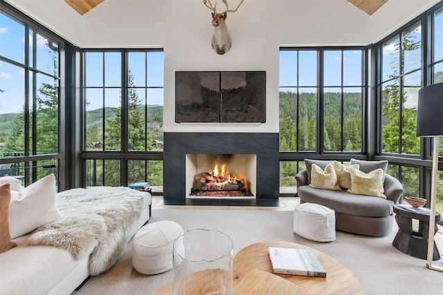 628 Independence Rd, Keystone, CO 80435 - carpeted bedroom featuring high vaulted ceiling, a fireplace with flush hearth, and wood ceiling