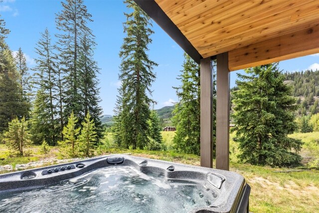 628 Independence Rd, Keystone, CO 80435 - view of patio featuring a hot tub and a mountain view