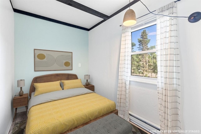 8011 Ryan Gulch Rd Unit B2, Silverthorne, CO 80498 - bedroom with baseboard heating and beam ceiling