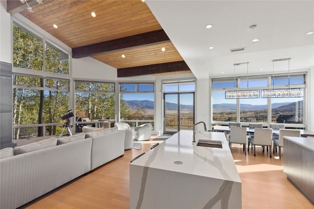 36125 Quarry Ridge Rd, Steamboat Springs, CO 80487 - living area with light wood finished floors, a mountain view, recessed lighting, and plenty of natural light