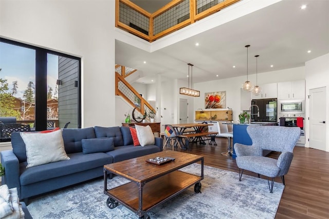 581 Fairview Blvd, Breckenridge, CO 80424 - living area featuring a high ceiling, dark wood finished floors, recessed lighting, and stairs