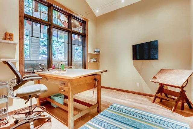 103 Victory Ln, Breckenridge, CO 80424 - home office featuring baseboards, wood finished floors, and high vaulted ceiling