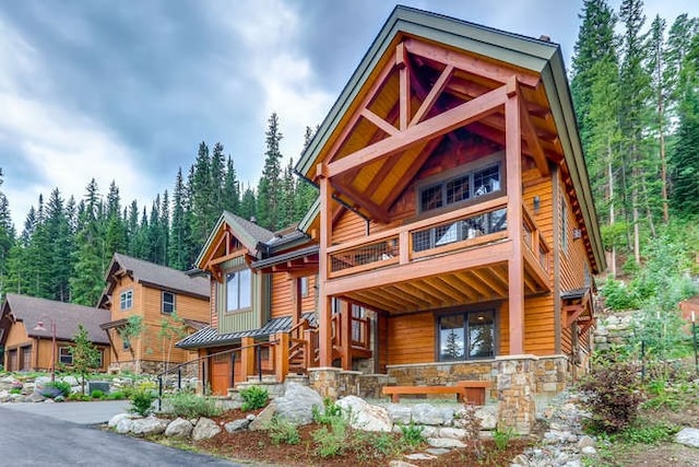 103 Victory Ln, Breckenridge, CO 80424 - exterior space with stone siding and a balcony