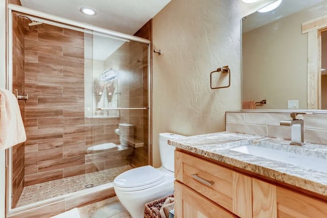 103 Victory Ln, Breckenridge, CO 80424 - full bathroom featuring recessed lighting, a shower stall, toilet, and vanity