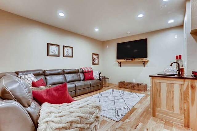 103 Victory Ln, Breckenridge, CO 80424 - living room with indoor wet bar, wood finished floors, and recessed lighting
