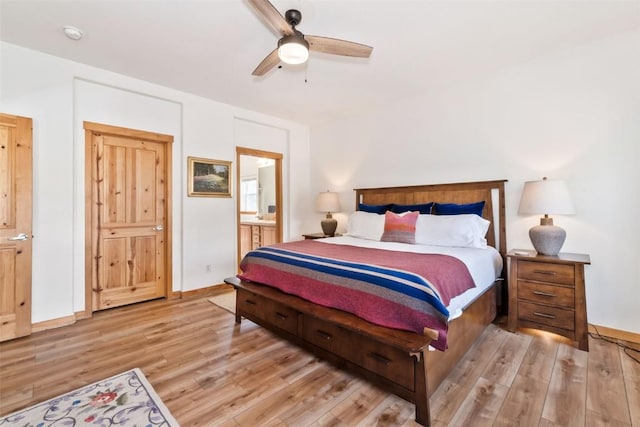 32404 Ute Trl, Oak Creek, CO 80467 - bedroom with baseboards, ceiling fan, light wood finished floors, and ensuite bath