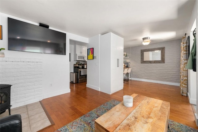 4 Sequoia Ct, Steamboat Springs, CO 80487 - living area with a wood stove and wood finished floors