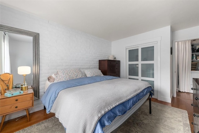 4 Sequoia Ct, Steamboat Springs, CO 80487 - bedroom featuring wood finished floors and brick wall