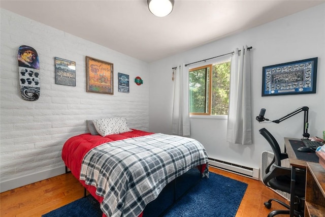 4 Sequoia Ct, Steamboat Springs, CO 80487 - bedroom with baseboard heating, wood finished floors, and a desk