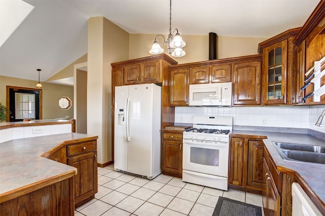 526 Sharps Way, Como, CO 80456 - kitchen featuring white appliances, a sink, vaulted ceiling, decorative light fixtures, and backsplash