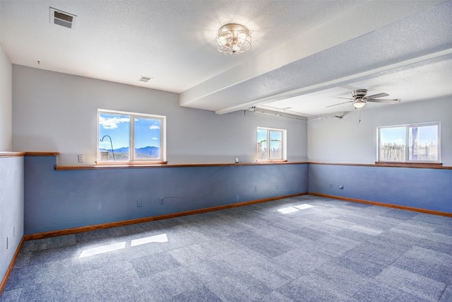 526 Sharps Way, Como, CO 80456 - carpeted spare room featuring baseboards, a ceiling fan, and a textured ceiling