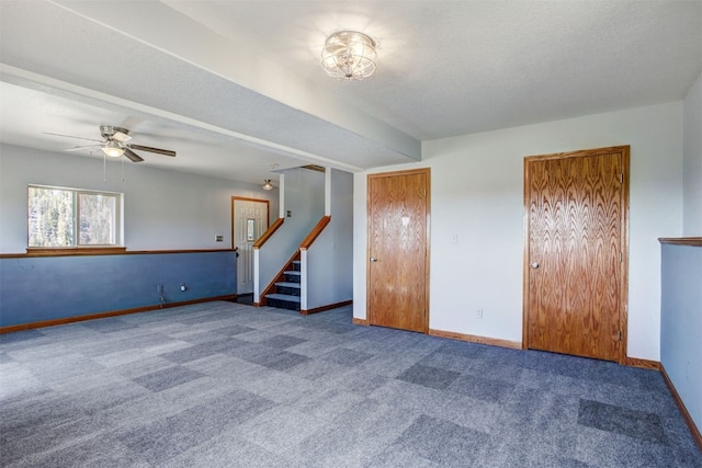 526 Sharps Way, Como, CO 80456 - spare room featuring carpet, a ceiling fan, stairs, and baseboards
