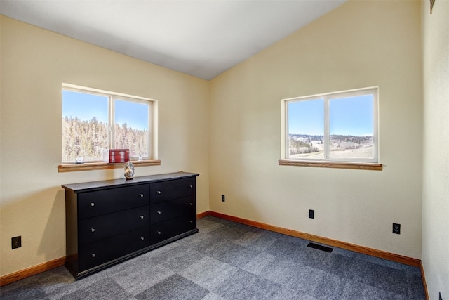 526 Sharps Way, Como, CO 80456 - bedroom featuring dark carpet, multiple windows, baseboards, and vaulted ceiling
