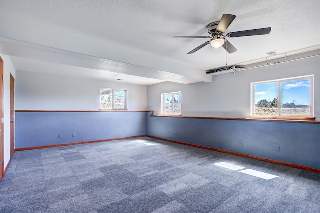 526 Sharps Way, Como, CO 80456 - carpeted spare room with baseboards, a ceiling fan, and a textured ceiling