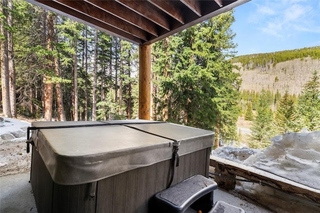 50 Cooney Ct, Blue River, CO 80424 - view of patio featuring a hot tub and a wooded view