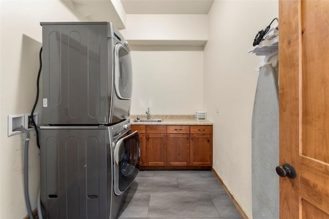 50 Cooney Ct, Blue River, CO 80424 - laundry area featuring stacked washer / drying machine and cabinet space