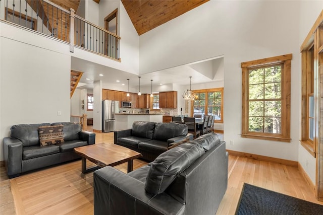 50 Cooney Ct, Blue River, CO 80424 - living room with light wood-style floors, a chandelier, and high vaulted ceiling