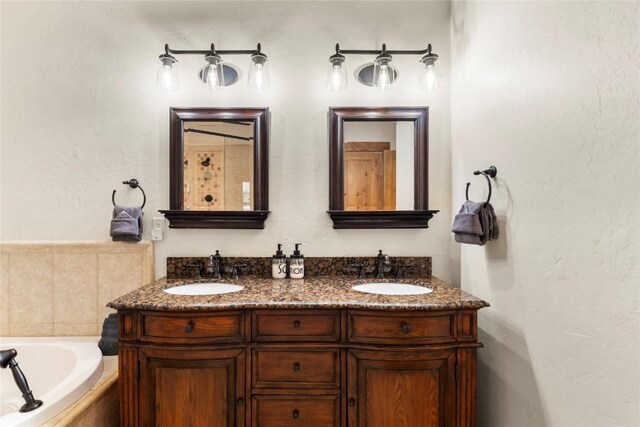 50 Cooney Ct, Blue River, CO 80424 - bathroom featuring double vanity and a bath