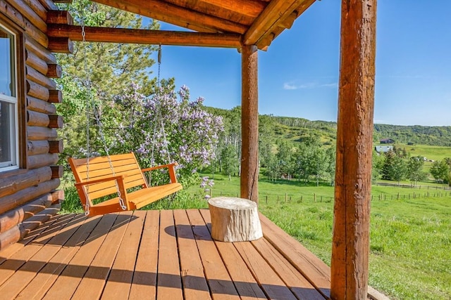 30955 Whitecotton Ct, Steamboat Springs, CO 80487 - wooden terrace featuring a lawn and a view of rural / pastoral area
