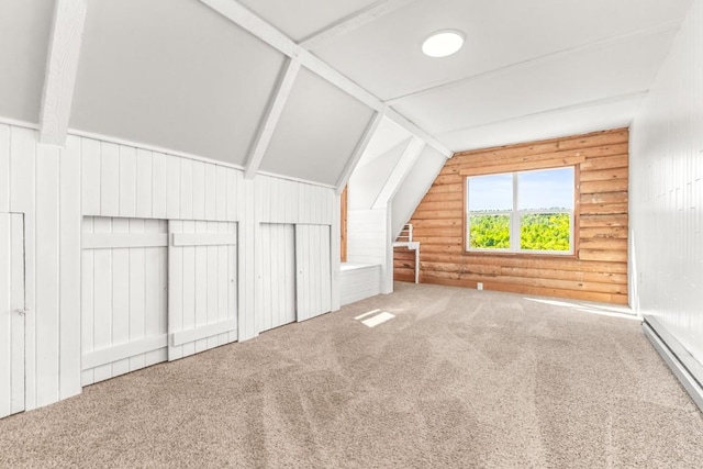 30955 Whitecotton Ct, Steamboat Springs, CO 80487 - additional living space with baseboard heating, vaulted ceiling, carpet flooring, and rustic walls