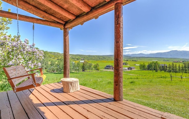 30955 Whitecotton Ct, Steamboat Springs, CO 80487 - wooden terrace featuring a rural view, a yard, and a mountain view