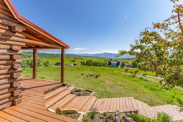 30955 Whitecotton Ct, Steamboat Springs, CO 80487 - wooden terrace with a view of countryside, a mountain view, and a lawn