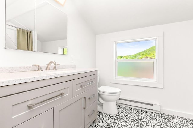 30955 Whitecotton Ct, Steamboat Springs, CO 80487 - full bath featuring baseboard heating, vanity, toilet, lofted ceiling, and baseboards