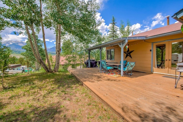 277 G Rd, Silverthorne, CO 80498 - deck with french doors, outdoor dining space, and a mountain view