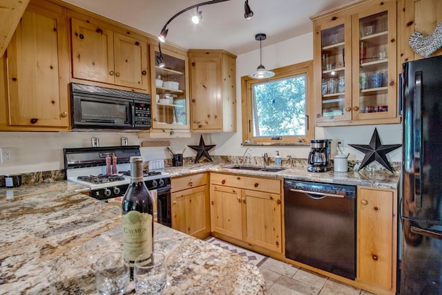 277 G Rd, Silverthorne, CO 80498 - kitchen with black appliances, light stone countertops, and glass insert cabinets