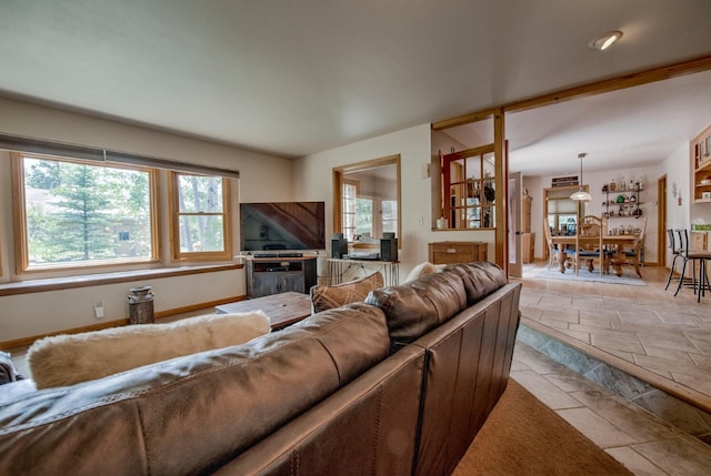 277 G Rd, Silverthorne, CO 80498 - living room featuring stone tile floors and baseboards