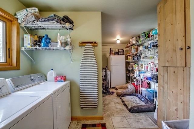 277 G Rd, Silverthorne, CO 80498 - washroom featuring washing machine and clothes dryer and light tile patterned floors