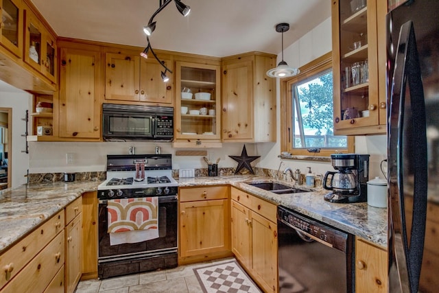 277 G Rd, Silverthorne, CO 80498 - kitchen with black appliances, light stone counters, glass insert cabinets, and pendant lighting