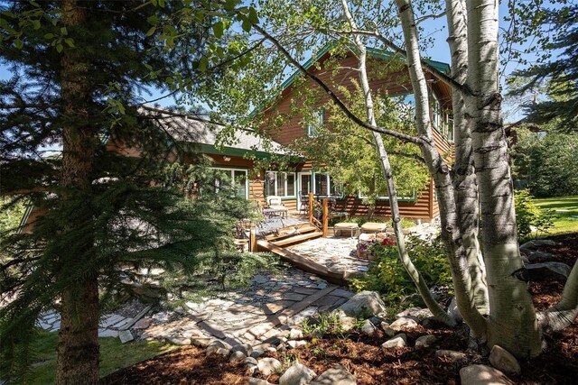 1064 Steamboat Blvd, Steamboat Springs, CO 80487 - rear view of house featuring a patio area
