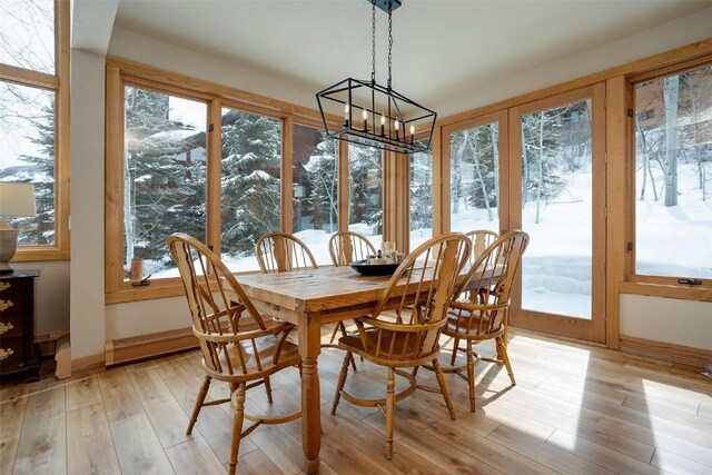 1064 Steamboat Blvd, Steamboat Springs, CO 80487 - sunroom / solarium with plenty of natural light, a notable chandelier, and french doors