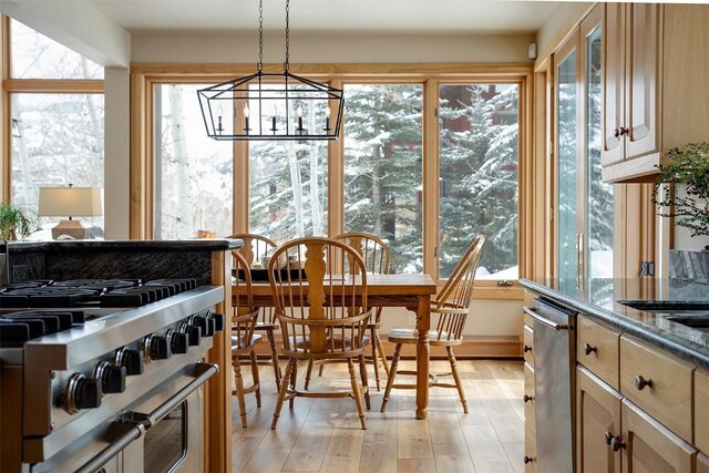 1064 Steamboat Blvd, Steamboat Springs, CO 80487 - sunroom with wood finished floors and a chandelier