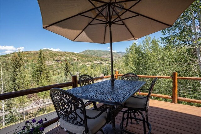 1064 Steamboat Blvd, Steamboat Springs, CO 80487 - deck with a mountain view and outdoor dining space
