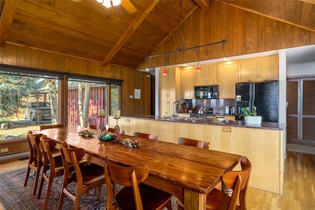 dining space featuring wood ceiling, ceiling fan, high vaulted ceiling, beamed ceiling, and light hardwood / wood-style floors