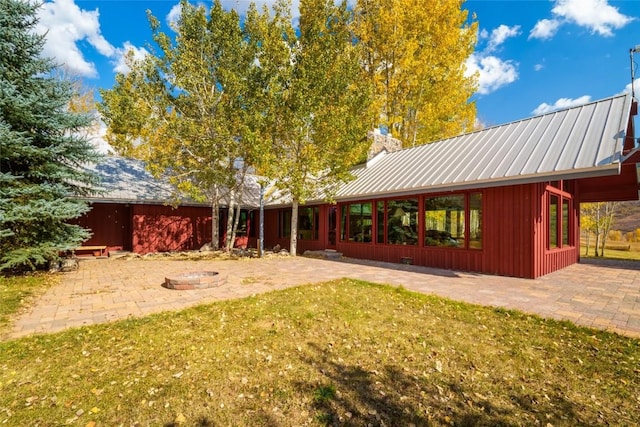 exterior space featuring a fire pit and a patio area