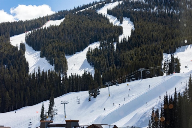 45 Beeler Pl Unit 301, Copper Mountain, CO 80443 - snowy aerial view with a forest view and a mountain view