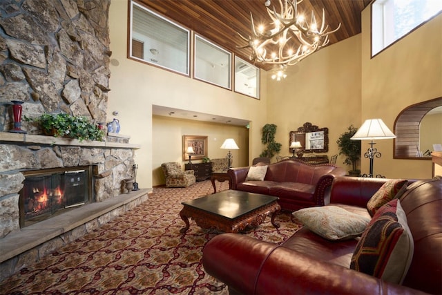 45 Beeler Pl Unit 301, Copper Mountain, CO 80443 - carpeted living room featuring a towering ceiling, a chandelier, wooden ceiling, a fireplace, and arched walkways