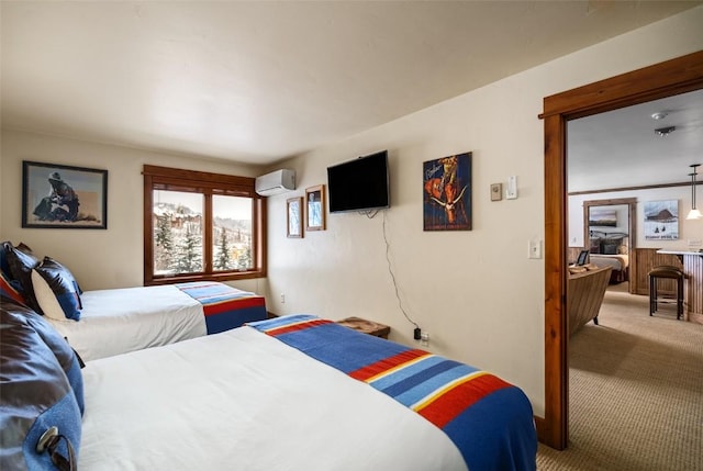 carpeted bedroom featuring a wall unit AC